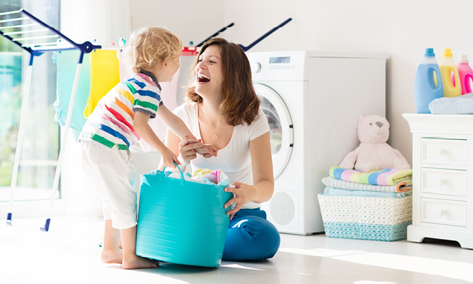 happy-mother-and-child-in-laundry-room