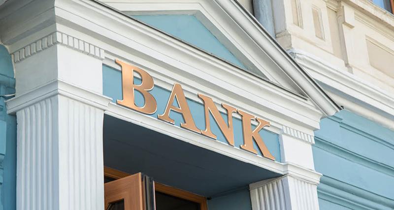 bank-building-exterior-gold-signage-cement-pillars