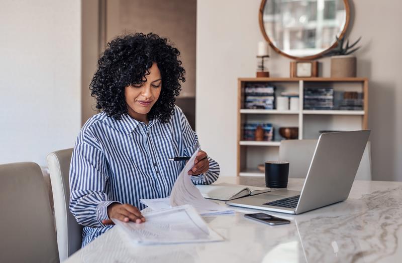 smiling-young-female-entrepreneur-going-through