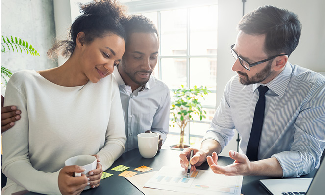 advisor-talking-to-couple-about-options-coffee-cups