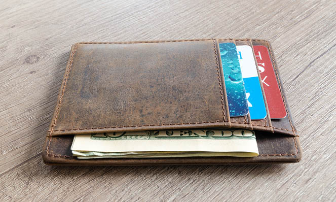 credit-cards-in-brown-leather-wallet-paper-bills