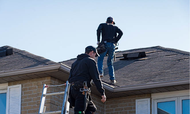 home-inspectors-on-house-roof
