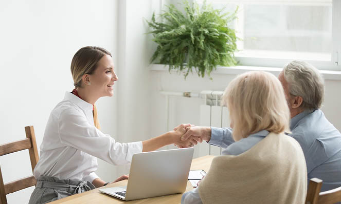 older-couple-consulting-with-female-advisor