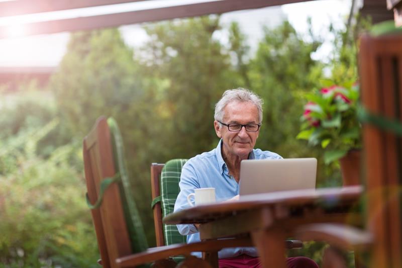 senior-man-sitting-outside-reverse-mortgage-financial-stability