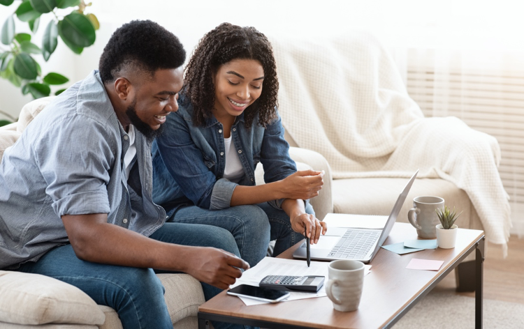 young-couple-looking-at-computer-online