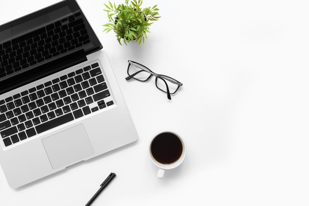 Laptop on white table